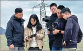  ?? ?? Zhang Chenliang and his team visit various sites while filming a documentar­y in the Xinjiang Uygur autonomous region.