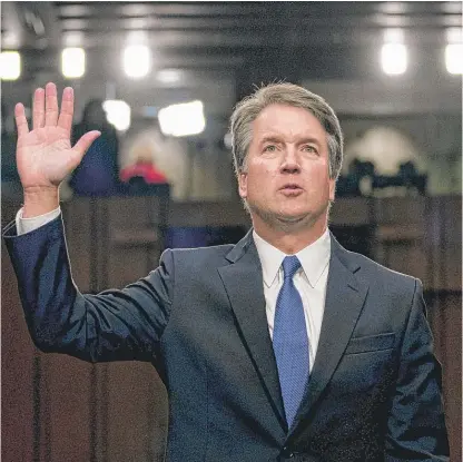  ?? ANDREW HARNIK/AP ?? Supreme Court nominee Brett Kavanaugh is sworn in before the Senate Judiciary Committee on Sept. 4.