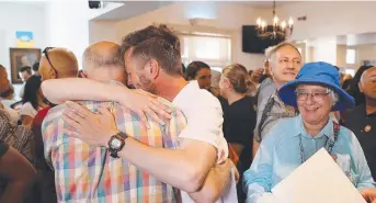  ?? Picture: SAM ROSEWARNE ?? HISTORIC DAY: Emotional scenes at the Cascade Hotel after the announceme­nt of the results of the same-sex marriage postal survey.