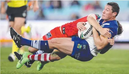  ??  ?? Dragons five-eighth Gareth Widdop crunches Bulldogs forward Josh Jackson. Picture: GETTY IMAGES