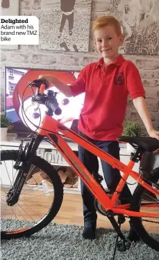  ??  ?? Delighted Adam with his brand new TMZ bike