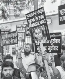  ?? PHOTO: PTI ?? AIMIM activists stage a protest demanding arrest of former BJP spokespers­on Nupur Sharma over her alleged comments against Prophet Muhammad, outside Parliament Street Police Station, in New Delhi