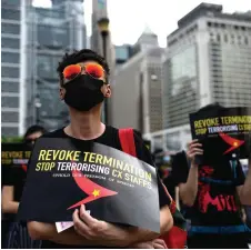  ?? — AFP photo ?? Pro-democracy protesters take part in a rally to support Cathay Pacific staff in Hong Kong.