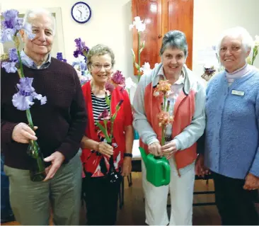  ??  ?? Prize winners of the George Moore Memorial Iris competitio­n Ron Blair, Aileen White and Dianne Dalton gave judge Lorraine Murfett a difficult task.