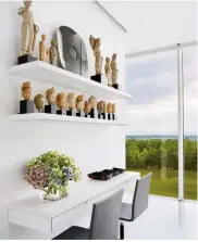 ??  ?? above buddhist sculptures are displayed on custom-made shelving in the master bedroom. the chairs are by maarten van severen for vitra right at dusk, the setting sun casts a warm glow on the glass expanse