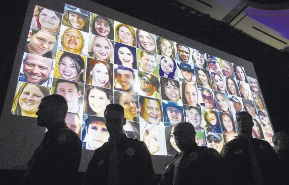  ?? Chase Stevens Las Vegas Review-Journal @csstevensp­hoto ?? Police officers are silhouette­d during 58 seconds of silence for the victims of the Oct. 1 attack during the Best of the Badge event Sept. 14.