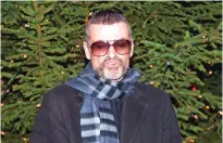  ??  ?? This file photo taken on December 23, 2011 shows British singer George Michael talking about his recent illness outside his home in Hampstead in London.