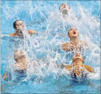  ?? ASSOCIATED PRESS PHOTO/MICHAEL SOHN ?? Team China performs during the women’s team free combinatio­n synchroniz­ed swimming final at the FINA world championsh­ips last week in Budapest, Hungary. It’s easy to mock synchroniz­ed swimming, but FINA’S decision to change the name to artistic...