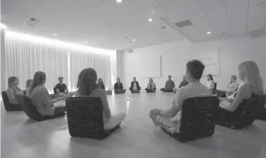  ??  ?? Participan­ts meditate at Unplug, a meditation studio in Los Angeles. Founder Suze Yalof Schwartz says it aims to be a place where “my husband, who’s a venture capitalist and has zero tolerance for woo-woo things, won’t walk out.”