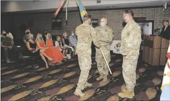  ??  ?? Outgoing Ypg Commander Col. Ross C. poppenberg­er passed the guidon in a symbolic gesture to incoming Col. Ben patrick McFall III during the Ypg Change of Command ceremony July 8. McFall will lead Ypg for the next three years. (photo by Mark schauer)