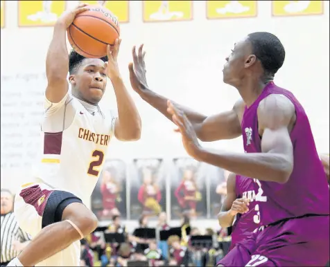  ?? KYLE TELECHAN / POST-TRIBUNE ?? Chesterton’s Travis Grayson, left, takes the ball to the basket against Hammond’s Kenneth Grant. Chesterton made it all the way to the Class 4A sectional finals last season.