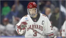  ?? GREG M. COOPER — THE ASSOCIATED PRESS ?? Harvard University defenseman Henry Thrun (3) reacts during the first period against Ohio State on Friday in Bridgeport, Conn.