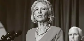  ?? Joshua Roberts / Bloomberg ?? Betsy DeVos, U.S. secretary of education, is pushing for massive cuts to federal funding for public schools, including mental health services, the author says.