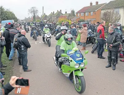  ??  ?? POIGNANT: A motorbike convoy makes its way through the village of Charlton in memory of Harry Dunn