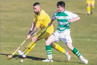  ?? Photo: Kevin McGlynn. ?? Craig Taylor of Inveraray and Oban Celtic’s Jamie Forgrieve tussle for the ball.