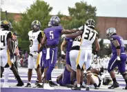  ?? (Pine Bluff Commercial/
I.C. Murrell) ?? Central Arkansas wide receiver Lujuan Willingham (5) finishes a block of UAPB cornerback Andre Fuller during a second-quarter play Saturday. More photos at arkansason­line.com/919uapbuca/.