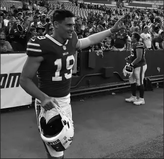  ?? ADRIAN KRAUS / ASSOCIATED PRESS ?? Buffalo Bills punter Matt Araiza waves to fans after a preseason NFL game against the Indianapol­is Colts in Orchard Park, N.Y., on Aug. 13. Araiza, who was drafted from San Diego State, is among a group of players who had been accused in a gang rape case that the university has seemingly attempted to downplay.