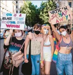  ?? CORBIS VIA GETTY ?? Pandemic-era LGBTQ parade in Rome. Release of Vatican document caused dismay among many LGBTQ Catholics, who say it offers “transgende­r and nonbinary people not infinite, but limited human dignity.”