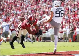  ?? Ian Maule/Tulsa World via AP ?? ■ Oklahoma's Brayden Willis (81) blocks a punt by West Virginia's Josh Growden (96) during an NCAA college football game Saturday in Norman, Okla.