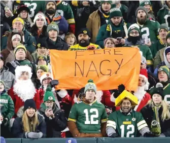  ?? AARON GASH/AP ?? Sign of the times: A ‘‘Fire Nagy’’ banner made the trip up to Green Bay, Wis.