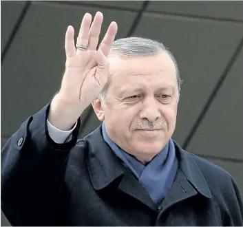  ?? ELIF SOGUT/GETTY IMAGES ?? Turkish President Tayyip Erdogan greet supporters at Ankara Esenboga Airport on April 17, 2017 in Ankara Turkey. Erdogan declared victory in Sunday’s historic referendum that will grant sweeping powers to the presidency, hailing the result as a...