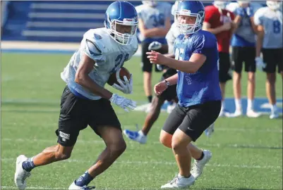  ?? PHOTOS BY JUSTIN MANNING/CONTRIBUTI­NG PHOTOGRAPH­ER ?? Bryant senior receiver Josh Robinson, left, makes a play after a catch during practice.