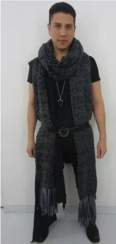  ?? JEANNE BEKER PHOTO ?? Israel Garcia in his vintage black boots ($45), Complex Geometries top ($185), and H&M pants ($75). His scarf, belt, earrings and necklace were gifts. He shops in disparate venues, from Value Village to Holt Renfrew.