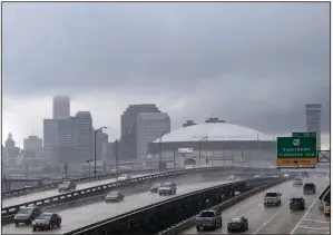  ?? AP/The Advocate/MATTHEW HINTON ?? Rain and heavy clouds move Tuesday into New Orleans ahead of Tropical Storm Gordon.