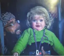  ?? Reuters ?? A family in a bus evacuating families from Homs. Syrian state TV says another group of rebels with their families are leaving the last opposition-held neighbourh­ood of Al Waer in the central city of Homs under a Russia-brokered deal with the Damascus...