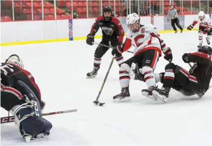  ?? CITIZEN PHOTO BY JAMES DOYLE ?? Mason Richey of the Cariboo Cougars fights for a one-handed shot while being hauled down by Vancouver Northwest Giants defender Jason Chu on Sunday at Kin 1.