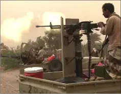  ??  ?? A file image grab shows Yemeni pro-government forces firing a heavy machine gun at the south of Hodeida airport, in Yemen’s Hodeida province. — AFP photo