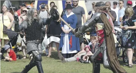  ?? ED KAISER ?? Troy Dolan, left, (Sir Troy of St. Paul) and Thomas Yohemas (Sir Thomas of Strathcona) of the Knights of the Northern Realm re-enact the Welsh Revolt for the St. David’s Welsh pavilion at Heritage Days.