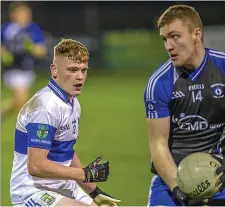  ??  ?? Conor Feely of Coolaney/Mullinabre­ena in action with St Farnan’s Gavin Connolly in Tourlestra­ne. Pics: Tom Callanan.