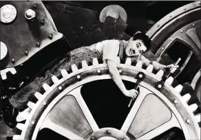  ??  ?? Charlie Chaplin in Modern Times (1936): a cog in the managerial machine