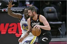  ?? DAVID DERMER — THE ASSOCIATED PRESS ?? Kevin Love drives against the Warriors’ Draymond Green on April 15.