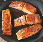  ?? The Associated Press ?? This recipe for honey-lime glazed roast salmon appears in the cookbook How to Roast Everything.