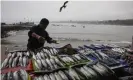  ??  ?? A fish seller in Lima in August. Peru’s foreign ministry expressed its ‘unease’ at the US embassy tweet’s ‘inconvenie­nt inaccuracy’ because the fleet was ‘demonstrab­ly’ outside its waters. Photograph: Rodrigo Abd/AP