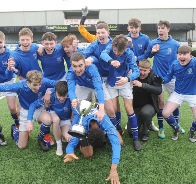  ??  ?? their 8-1 victory over Balbriggan Community College in the Leinster Minor Division Two final in Oriel Park.