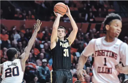  ?? STEPHEN HAAS
THE ASSOCIATED PRESS ?? Purdue guard Dakota Mathias shoots against Illinois guard Da'Monte Williams in February.