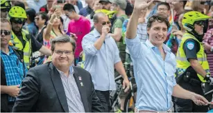  ?? PETER MCCABE ?? Prime Minister Justin Trudeau joined Montreal Mayor Denis Coderre in the Pride parade Sunday, which led to some homophobic online comments.