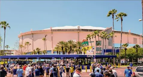  ?? Martha Asencio-rhine / TNS ?? Fans line up to enter Tropicana Field for opening day in 2022. Plans for a new ballpark were unveiled on Monday.