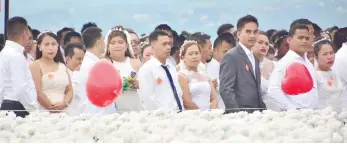  ?? SUNSTAR FOTO / ALLAN CUIZON ?? FOR BETTER OR WORSE, 150 TIMES. Pag-Ibig sponsors a mass wedding for 150 couples the other day at the 10,000 Roses Cafe in Cordova.