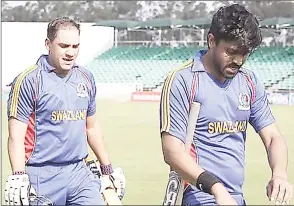  ?? (Courtesy pic) ?? Eswatini Senior Men’s Cricket National team players Estean Sauerman and Harris Rashid during one of the national team games.