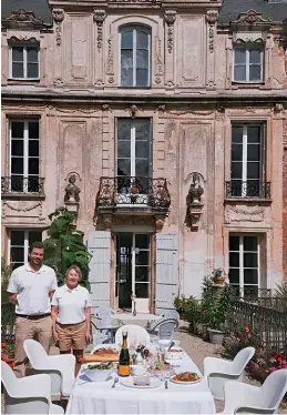  ??  ?? A table set for a picnic at Château de Longecourt, a ducal hunting lodge turned hotel in Longecourt­en-Plaine.