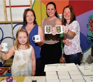  ??  ?? Cheers Heather McMichael (8) with mum Hazel, Lorna Dobinson and Linda Brown with the Mossneuk commemorat­ive mugs