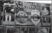  ?? Arkansas Democrat-gazette/dave HUGHES ?? This billboard was unveiled Friday on U.S. 71B in Waldron to honor the memory of Scott County Sheriff Cody Carpenter and Arkansas Came and Fish Commission Wildlife Officer 1st Class Joel Campora.