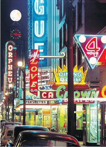  ?? KEN OAKES/FILES ?? The Vancouver Sun and Province are donating an estimated two million images, dating from the 1940s to the early 1990s, to the Vancouver Archives. Included in the many stills of B.C. history is this Ken Oakes picture of neon signs on Granville Street,...