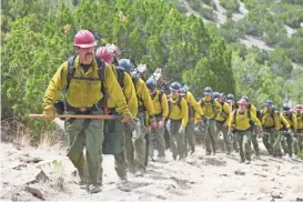  ?? RICHARD FOREMAN ?? "Supe" Eric Marsh (Josh Brolin) leads the Granite Mountain Hotshots up the trail in a scene from “Only the Brave,” which examines the Yarnell Hill Fire that killed 19 firefighte­rs in 2013.