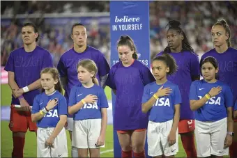  ?? PHELAN M. EBENHACK — THE ASSOCIATED PRESS ?? Canada players wear purple shirts with “Enough is Enough” written on them during the national anthems before the team’s SheBelieve­s Cup soccer match against the United States, Thursday, Feb. 16, 2023, in Orlando, Fla.