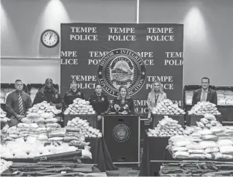  ?? JOEL ANGEL JUAREZ/THE REPUBLIC ?? Arizona Attorney General Kris Mayes, center, speaks during a press conference announcing a three-year long investigat­ion targeting the Sinaloa Cartel at the Tempe Police Department Apache Boulevard Substation in Tempe on Thursday.